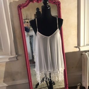 Lovely white loose fitting tank top with fringe